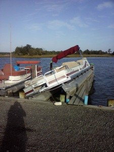 pontoon on dock, storm surge boat damage, delaware, sussex county, white house beach, long neck, check your boats